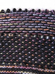 RS & WS of a slip stitch pattern worked in Malabrigo & Lorna's Laces Pearl.